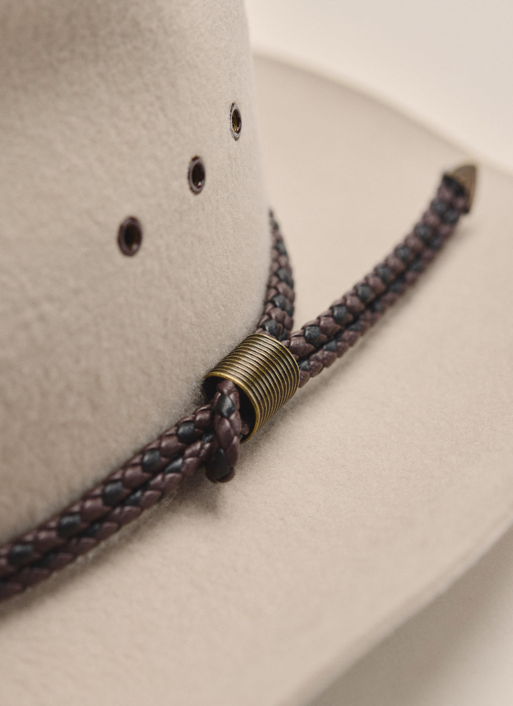 Close up, side profile of Kidman Drover Hat in Stone, showing wide brim and soft leather sweatband