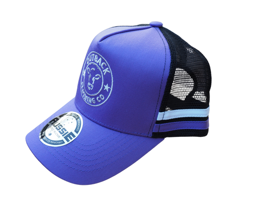 Side view of purple kids trucker cap with purple and white side stripe, white logo embroidery, and black mesh back by Outback Clothing Co.