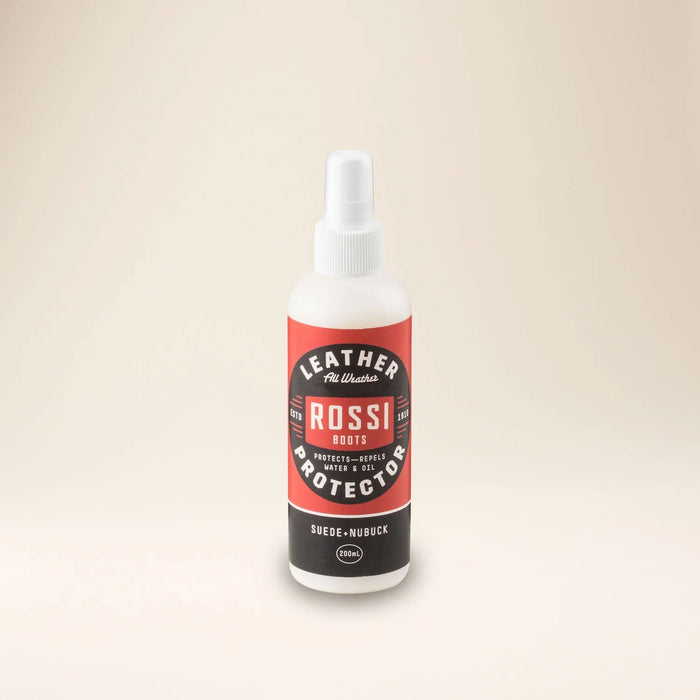 Outback Clothing Co. Suede and Nubuck Protector spray bottle on a wooden surface