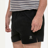 Side view of Swanndri Men's Cotton Rugby Shorts in Navy showing relaxed fit and outer hem split.