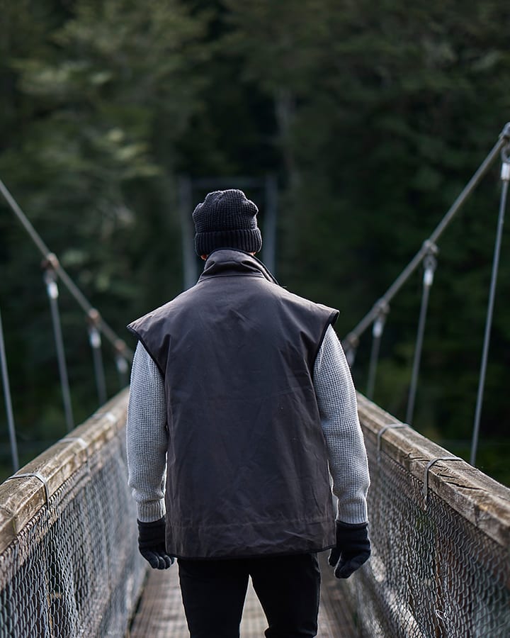 Rear view of the Levels Oilskin Vest SSD2802, highlighting the drop hem and overall cut