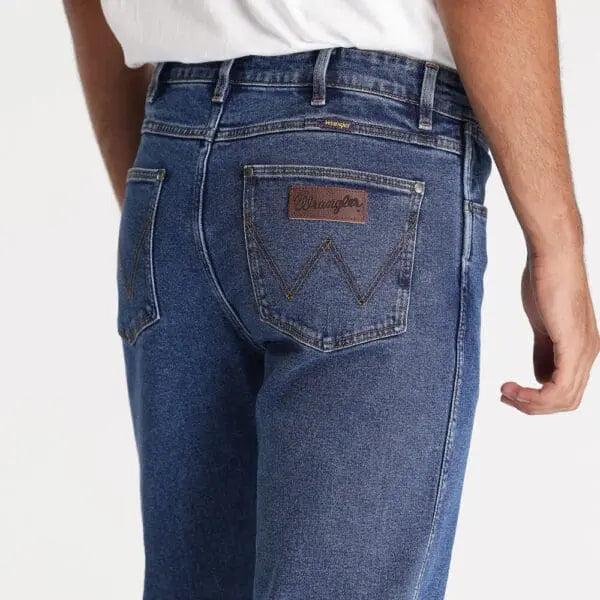 Close-up of Wrangler Men's Classic Straight Jean fabric: Durable 100% cotton denim with a broken-in feel
