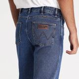 Close-up of Wrangler Men's Classic Straight Jean fabric: Durable 100% cotton denim with a broken-in feel