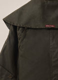 Back view of Driza-Bone Kids Rider Coat showing long-line oilskin design and reinforced stitching.