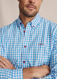 Close-up of S.Kidman Holstein Long Sleeve Shirt in Pale Blue gingham, showing red buttons, collar and embroidered chest detail.