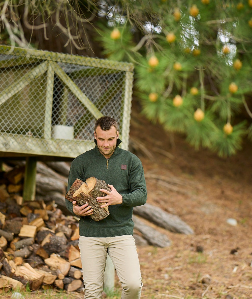 Model wearing the Mariner Jumper in Olive, styled casually with jeans for a rugged outdoor look.
