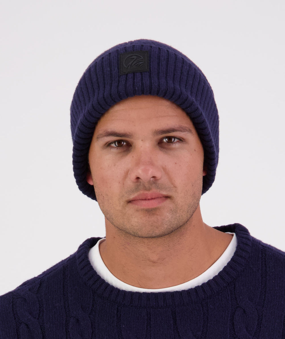 Swanndri Newton Beanie in blue – front view showing ribbed knit texture and cuff.