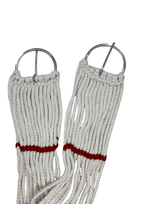 Soft cord material of horse girth showing flexibility.