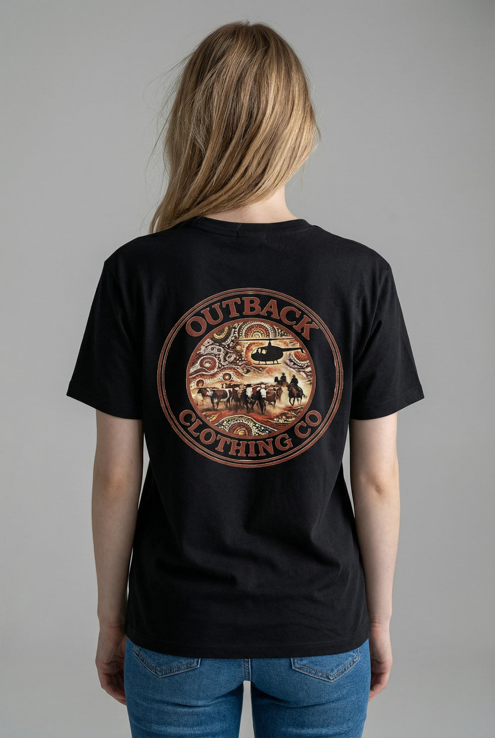 Person wearing a black t-shirt with Outback Clothing Co muster image on the back in the centre, large.