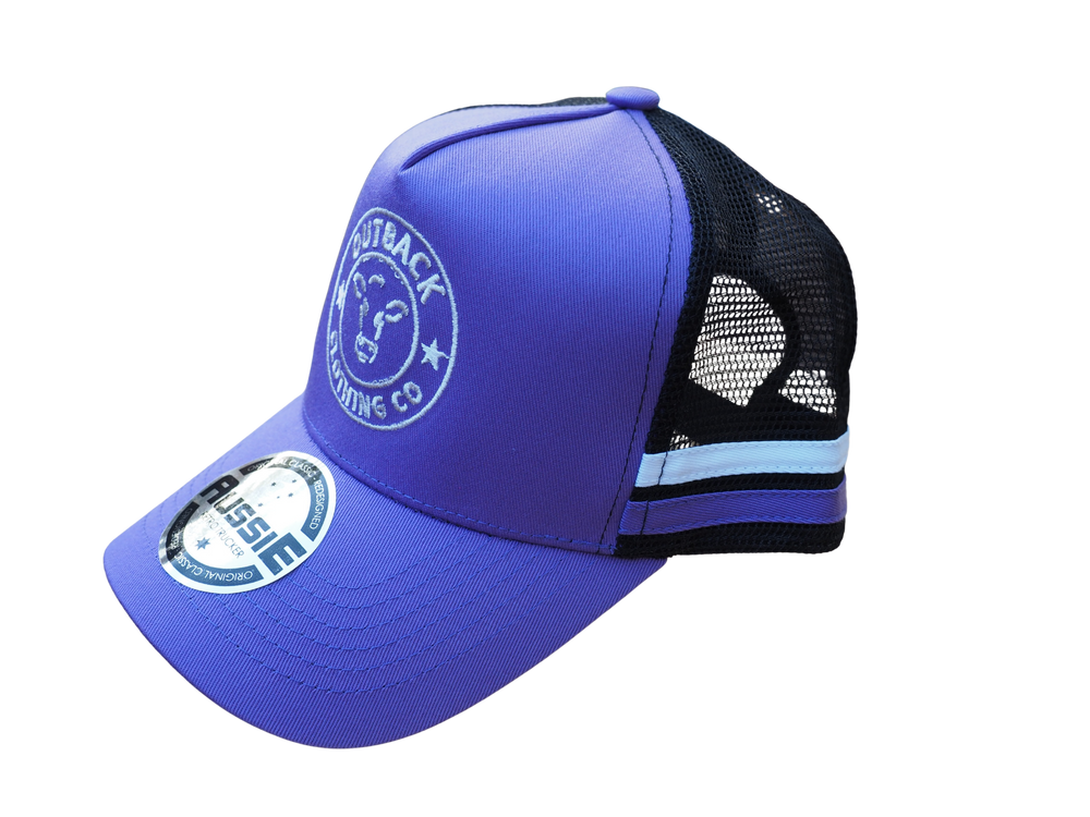 Side view of purple kids trucker cap with purple and white side stripe, white logo embroidery, and black mesh back by Outback Clothing Co.