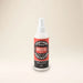 Outback Clothing Co. Suede and Nubuck Protector spray bottle on a wooden surface