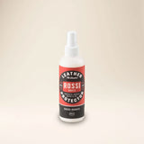 Outback Clothing Co. Suede and Nubuck Protector spray bottle on a wooden surface
