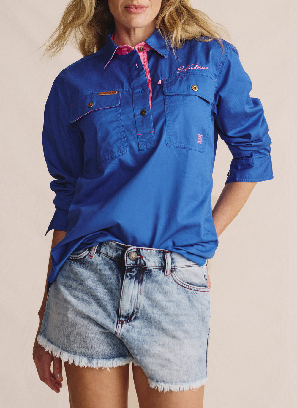 Front view of the S. Kidman Camfield Half Placket Work Shirt in mid blue, featuring button-up half placket and chest pockets.