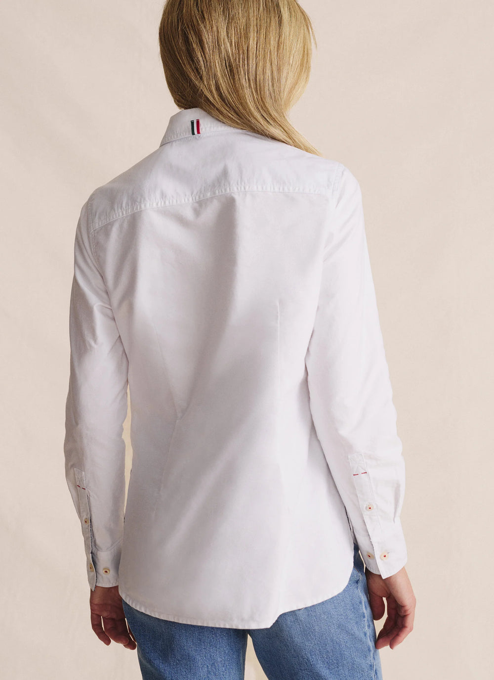 Back view of S.Kidman Lennard Long Sleeve Shirt in White – extended back tail with double-stitched seams and back yoke pleats.