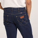Durable denim texture of Wrangler Classics Men's Bootcut Jean – Faded wash with contrast stitching and copper rivets.