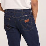 Durable denim texture of Wrangler Classics Men's Bootcut Jean – Faded wash with contrast stitching and copper rivets.