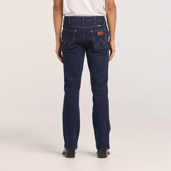 Men's Regular Bootcut Jean by Wrangler – Relaxed fit through thigh, flared leg for easy wear over boots.