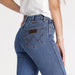 Durable denim texture and button-fly design on Wrangler Women's Straight Jean for everyday comfort.