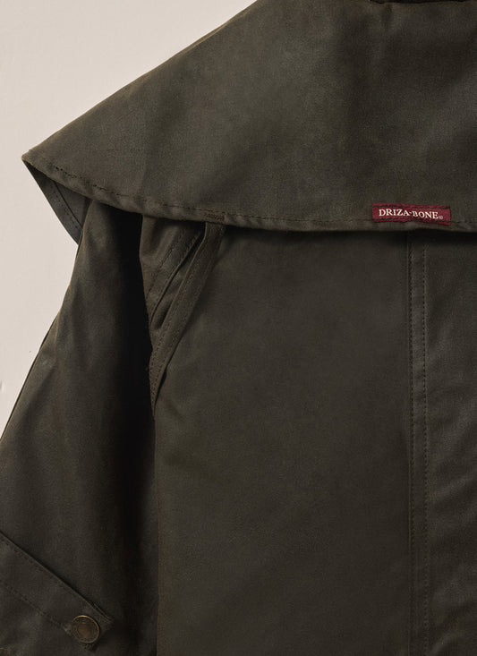 Back view of Driza-Bone Kids Rider Coat showing long-line oilskin design and reinforced stitching.