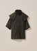 Child wearing Driza-Bone Kids Rider Coat, front view, waterproof brown oilskin outback jacket with detachable hood.