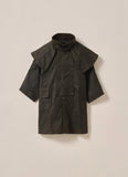 Child wearing Driza-Bone Kids Rider Coat, front view, waterproof brown oilskin outback jacket with detachable hood.