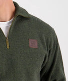 Side profile of the Olive Mariner Jumper, emphasizing its classic crewneck design and versatile layering fit.