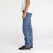 Side view showing straight leg fit on denim jeans