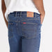 Close-up of durable metal rivets and triple-needle stitching on Riders by Lee Classic Straight Stretch Jeans.
