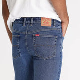 Close-up of durable metal rivets and triple-needle stitching on Riders by Lee Classic Straight Stretch Jeans.