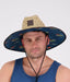 Swanndri Whangamata Straw Hat worn outdoors with UPF 50+ sun protection and adjustable chin strap for hiking or beach activities