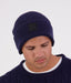 Swanndri Newton Beanie in blue – right side profile showing wool knit and Swanndri logo tag.