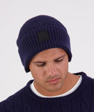 Swanndri Newton Beanie in blue – right side profile showing wool knit and Swanndri logo tag.
