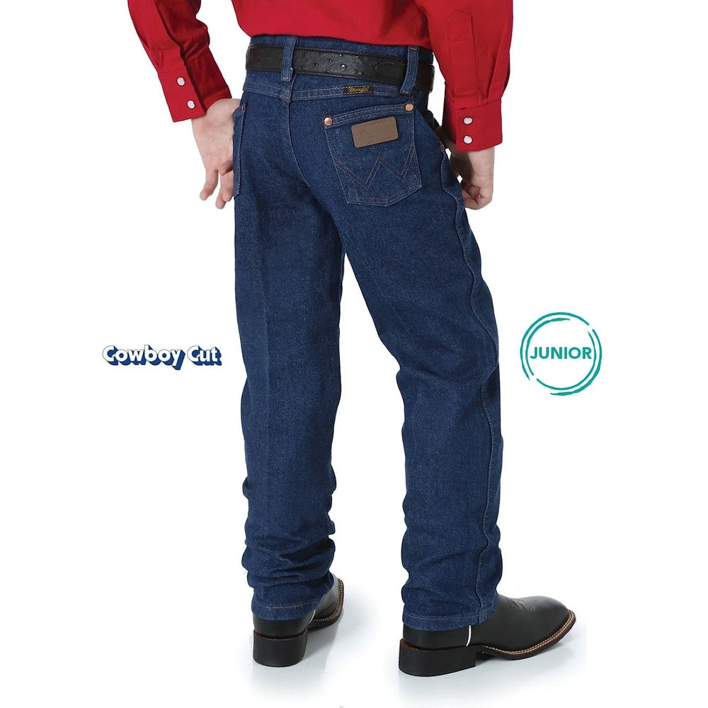 Back view of boy wearing Wrangler Junior Original ProRodeo Jeans in Prewashed Indigo, highlighting Junior Cowboy Cut